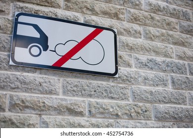 No Car Carbon Dioxide (CO2) Emissions Allowed Sign Attached To A Stone Wall In An Environmentally Friendly District