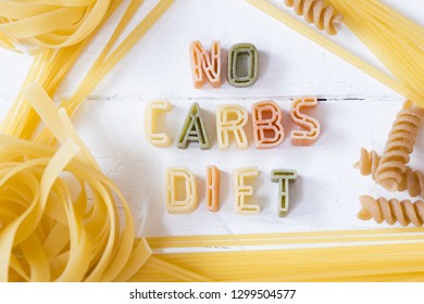 No Carbs Diet Text Written With Colorful Pastas On White Wooden Background