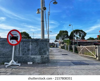 No cars allowed sign. On the background of the village road - Shutterstock ID 2157808351