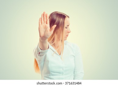 No Closeup Portrait Young Angry Serious Woman Showing Her Denial Stop Talk To Hand Gesture With Palm Outward Isolated Green Wall Background Negative Human Emotion Face Expression Feeling Body Language