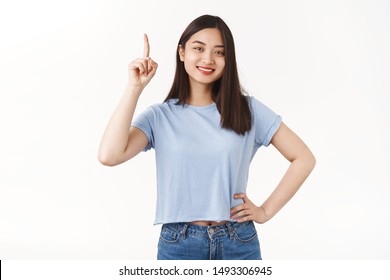 No Clouds Perfect Day Summer Picnic. Cute Delighted Happy Cheerful Asian Pretty Girl Pointing Index Finger Up Head Top Smiling Broadly Toothy Positive Grin Give Advice Suggest Use Promo