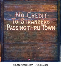 No Credit Sign Painted On Metal Door In Wild West Town
