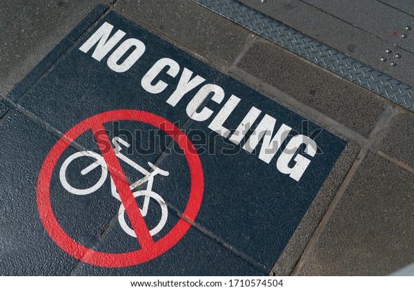 No\
Cycling footpath sign white on black with red\
symbol.
