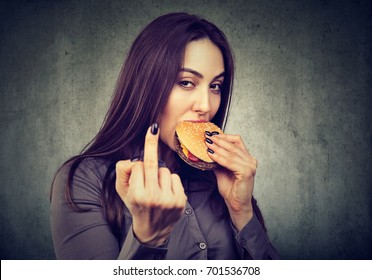 No Diet For Me! Young Woman Enjoying Her Tasty Cheeseburger  