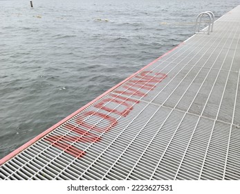 No Diving Sign By The Wooden Deck, Perspective View