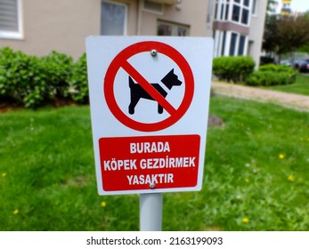 No dogs allowed sign in Turkish in a garden, Dog prohibited. Warning, road sign, no pets sign, prohibition, forbidden circle, crossed out red circle, ban symbol - Shutterstock ID 2163199093