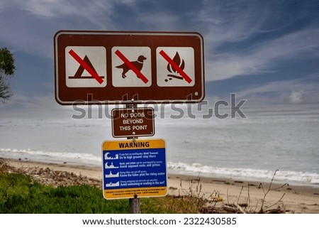 No dogs, no camping, no fire sign on a beach