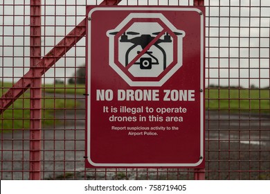 No drone flying warning sign on a perimeter fence  of airport airspace 