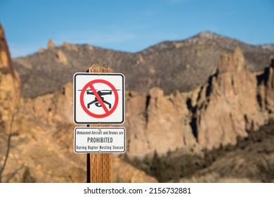 No Drone Flying Zone sign (intentional background blur) due to raptor nesting season