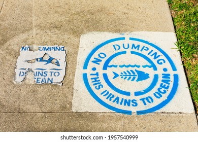 No Dumping Drains To Ocean Warning Sign Guards Drain Inlet Near Storm Drain - Los Angeles, California, USA - 2020