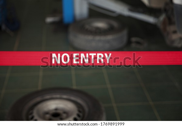 no entry, the inscription on the red bar in the car
service, close up