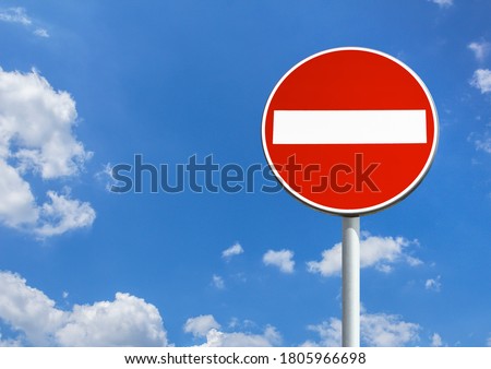 No entry sign against blue sky with copy space