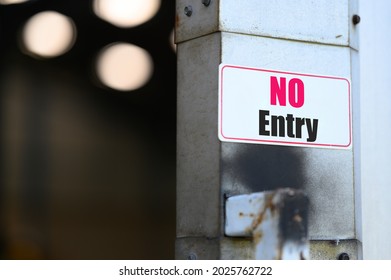 No Entry Sign Is Attached To The Entrance To A Warehouse Or Factory.