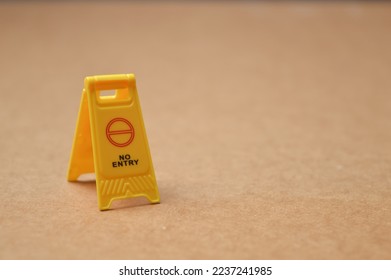 No entry sign isolated on a brown background. Copy space for the text. - Shutterstock ID 2237241985