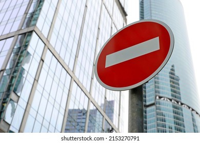 No Entry Sign On Skyscrapers Background In Downtown. Concept Of Economic Sanctions, Financial Crisis, Global Business