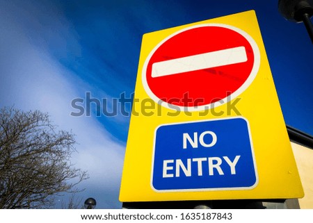 No entry sign, red white and blue on a yellow background￼