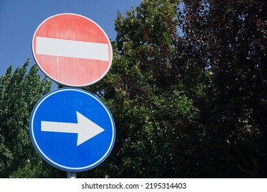 No Entry Sign And Right Turn Sign, Red And Blue Sign On A Plain Background