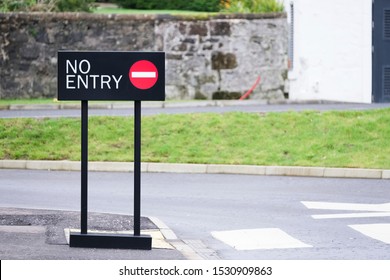 No entry sign at road crossing on street