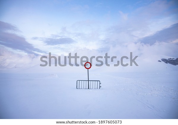 
no
entry or transit, on a snow-covered road, over one meter of snow.
desolation and silence in an abandoned
landscape.