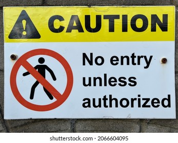 No entry unless authorised sign mounted on a wall
