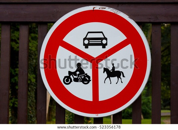 No entry to vehicles indicated, no animal riders -\
road sign