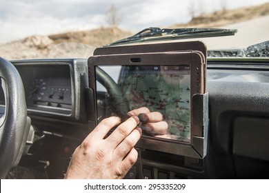 No Face Unrecognizable Person Man Holding Mobile Phone With Gps Application In The Car With Tablet Screen Computer Sun Light On Finger Sunset Rays On Hands Soldier Male Inside Brutal SUV Car