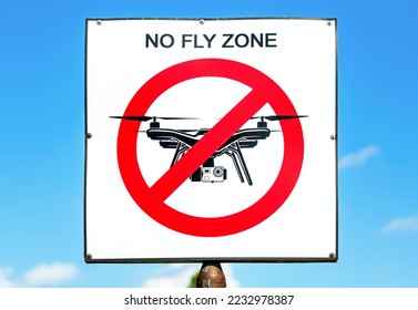 No fly zone sign against a blue sky background. No drone zone sign