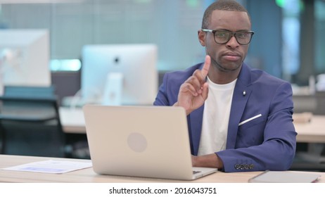 No Gesture With Head Shake By Young African Businessman At Work