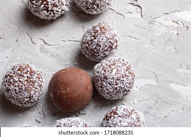No gluten raw coconut cacao balls. Grey background and place for text. No sugar