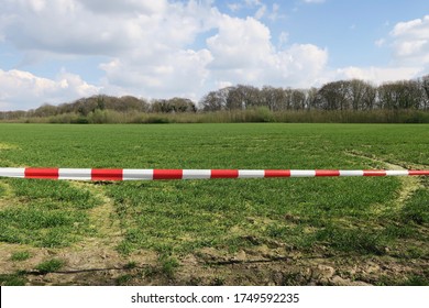 No Go Area: A Landscape Behind White And Red Barrier Tape