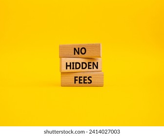 No hidden fees symbol. Concept word No hidden fees on wooden blocks. Beautiful yellow background. Business and No hidden fees concept. Copy space