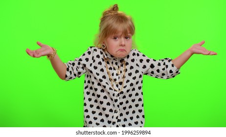 No Idea, I Dont Know Answer. Puzzled Clueless Uncertain Blonde Kid Child Raising Hands In Helpless Gesture, Embarrassed Confused By Difficult Question. Teenager Children Girl On Chroma Key Background