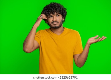 No idea, I dont know answer. Puzzled clueless uncertain indian handsome man raising hands in helpless gesture, embarrassed confused by difficult question. Confused one guy on chroma key background - Powered by Shutterstock