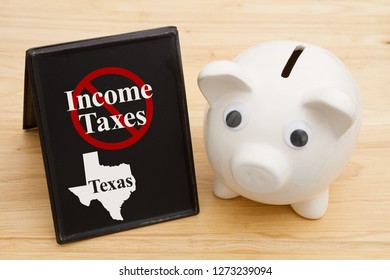 No Income Tax In The State Of Texas Message With A Piggy Bank On A Retro Freestanding Chalkboard On A Wood Desk