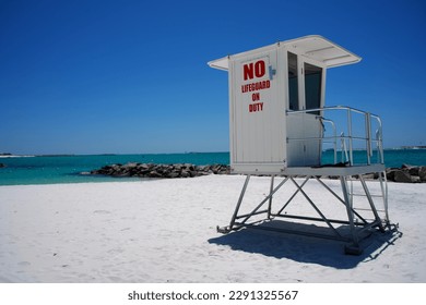 No Life Guard on Duty Painted on Life Guard Tower Overlooking White Beach in Florida