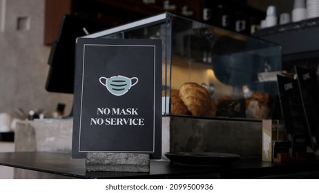 No Mask No Service Warning Sign In Cafe Counter, New Pandemic Rules And Restrictions In Caterings 