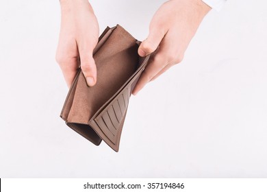 No Money. Male Hands Demonstrating Open Wallet With Nothing In It. 