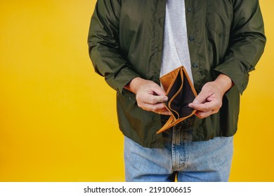 No Money In Wallet ,unemployed Asian Old Man Opening Empty Wallet Money Broke Cash, Bankruptcy Economic Financial , Poverty In Retirement And Unemployment Concept.