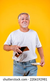 No Money In Wallet ,unemployed Asian Old Man Opening Empty Wallet Money Broke Cash, Bankruptcy Economic Financial , Poverty In Retirement And Unemployment Concept.