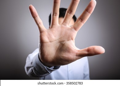 No More Concept,Stop Gesture. Man with raised opening hand making No more gesture. No more Unhealthy food, No more smoking,Alcohol. - Shutterstock ID 358502783