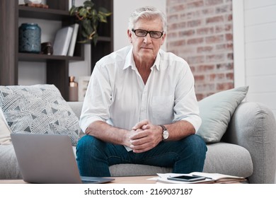 No Need To Recognise The Road Ahead. Portrait Of An Older Man Using His Laptop While Sitting On The Couch At Home.