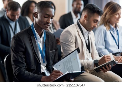 No need for shame, I get peace at slow speeds. Shot of a group of businesspeople taking notes during a meeting in an office. - Powered by Shutterstock