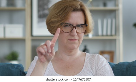 No, Old Woman Rejecting Offer By Waving Finger