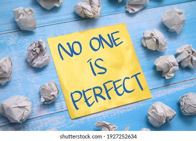 No one is perfect, text words typography written on paper against wooden background, life and business motivational inspirational concept