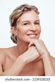 No One Regrets A Good Skincare Regime. Shot Of A Beautiful Mature Woman Posing Against A White Background.