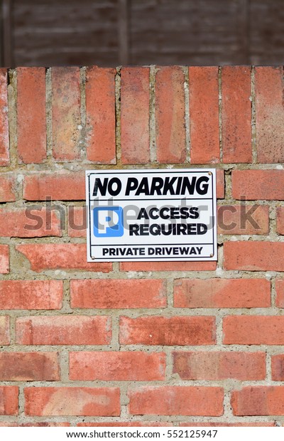 No Parking -\
Access Required sign on wall