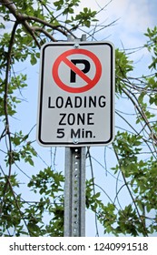 A No Parking, Five Minute Loading Zone Sign