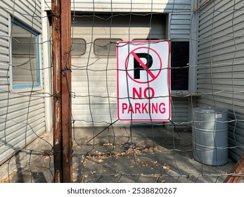 no parking sign on an abandoned rusted fence - Powered by Shutterstock