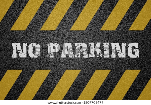 No Parking Sign on asphalt\
ground