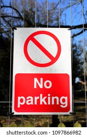 A No Parking Sign On A Fence, UK